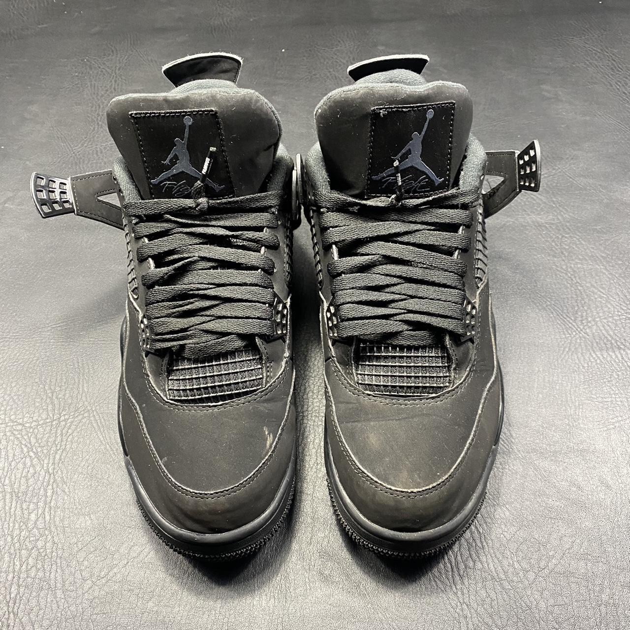 black cat 4s with white laces