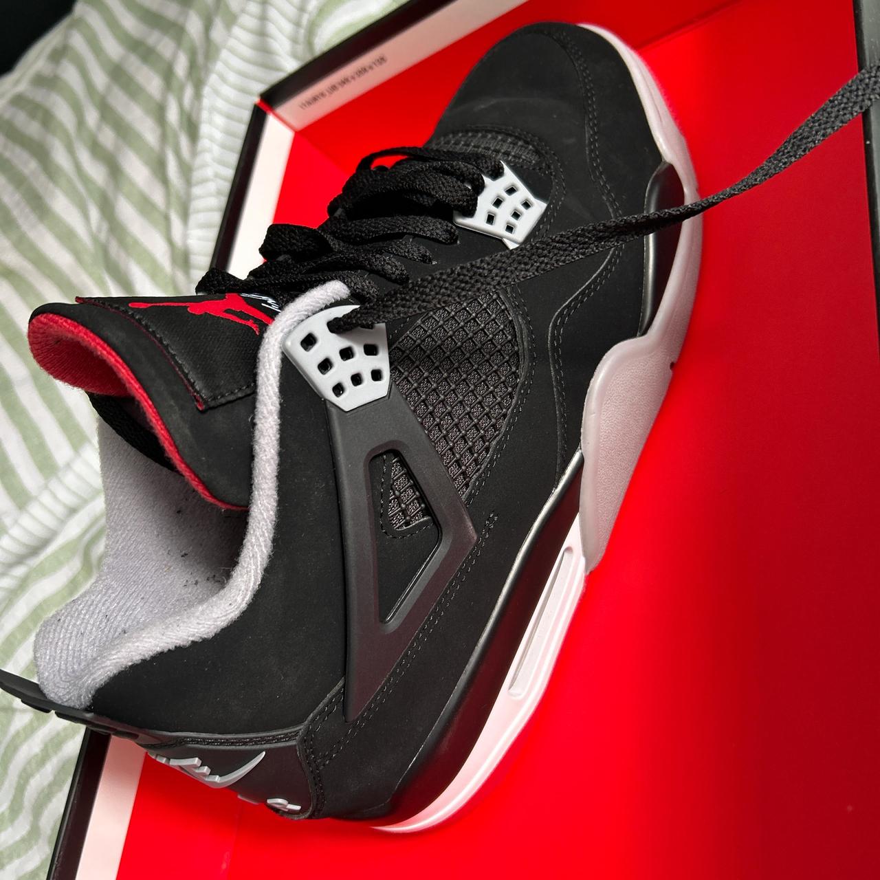 Black fire red jordan 4 best sale