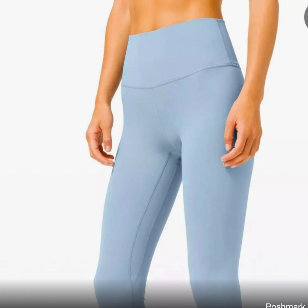 light blue lululemon leggings rest just above my