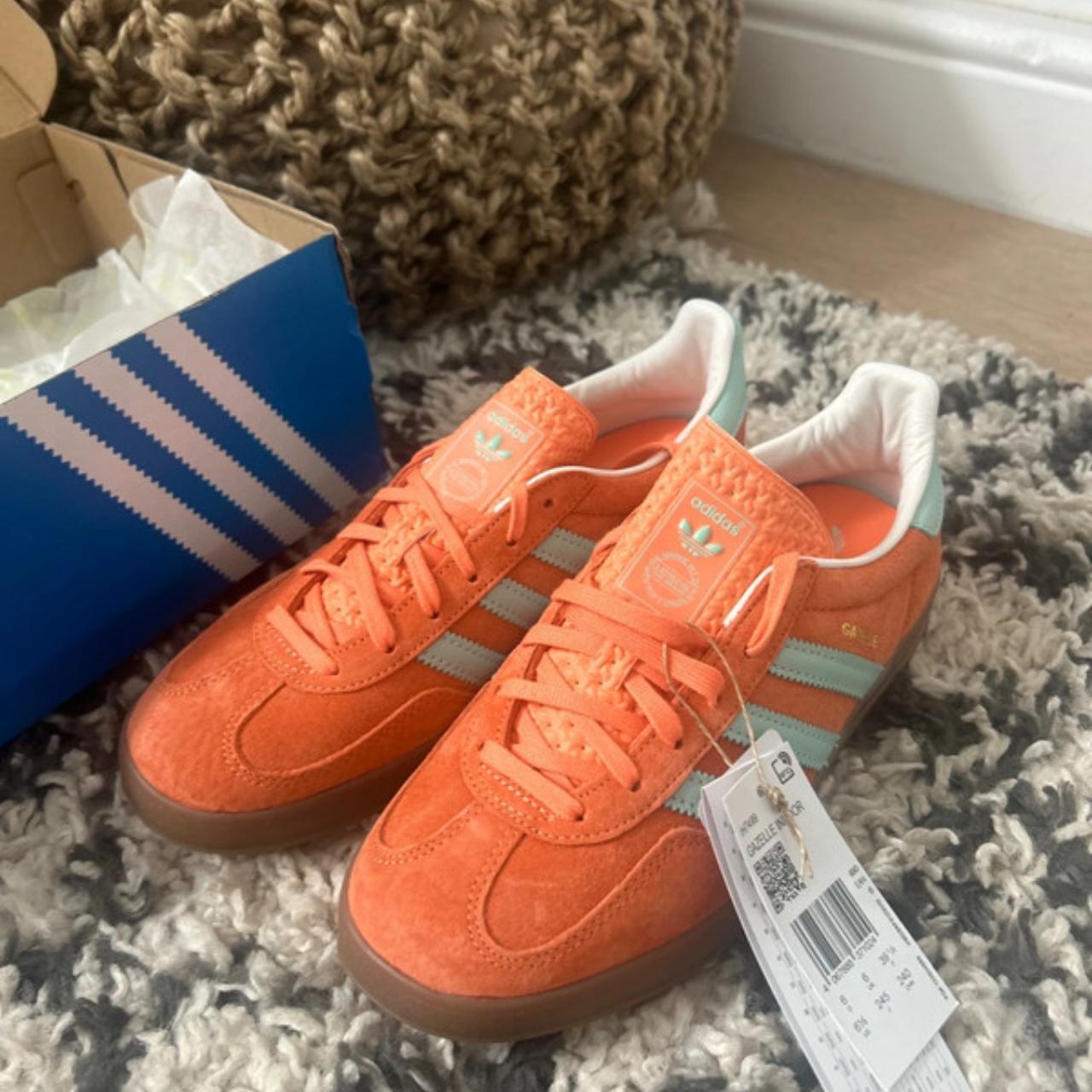 Peach and pink Adidas Gazelle trainers