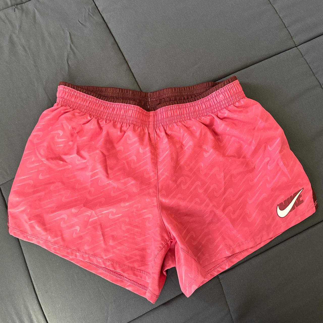 Hot pink Nike Dri Fit running shorts. Swoosh Nike