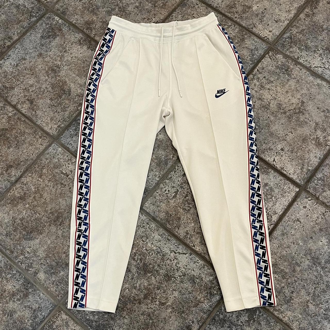 nike taped poly track pants