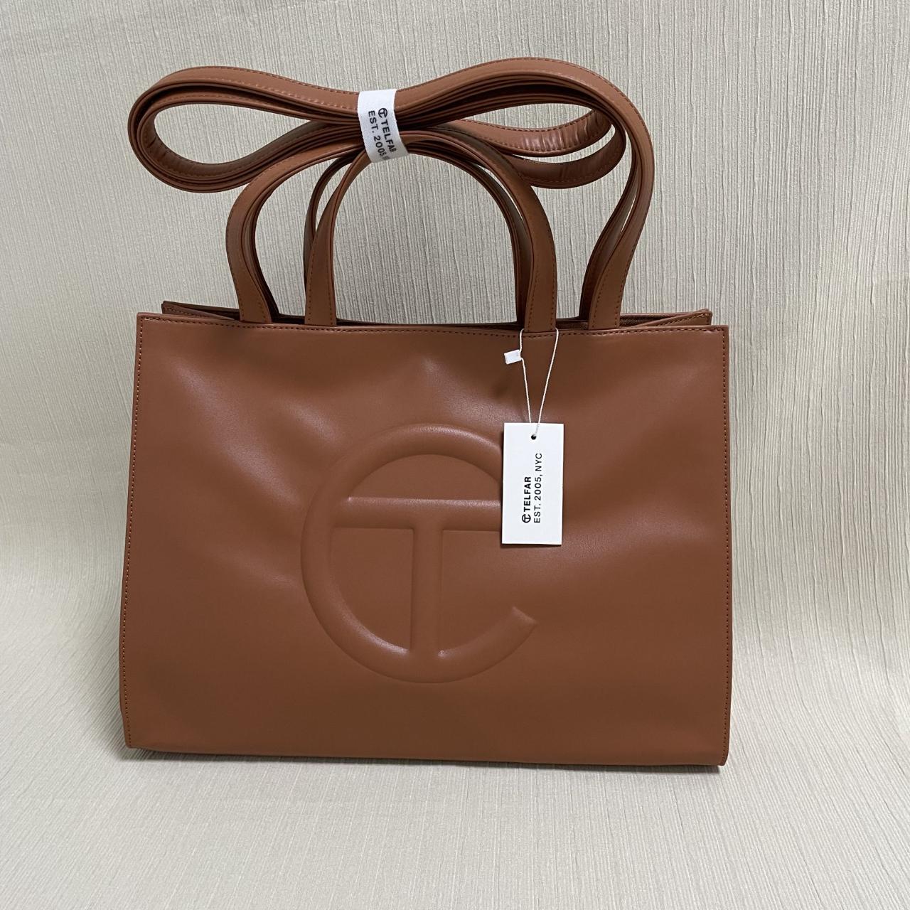 Woman selling Medium Tan Shopping Bag