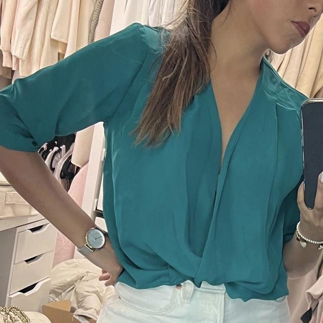 Teal green blouse with a V neckline and long