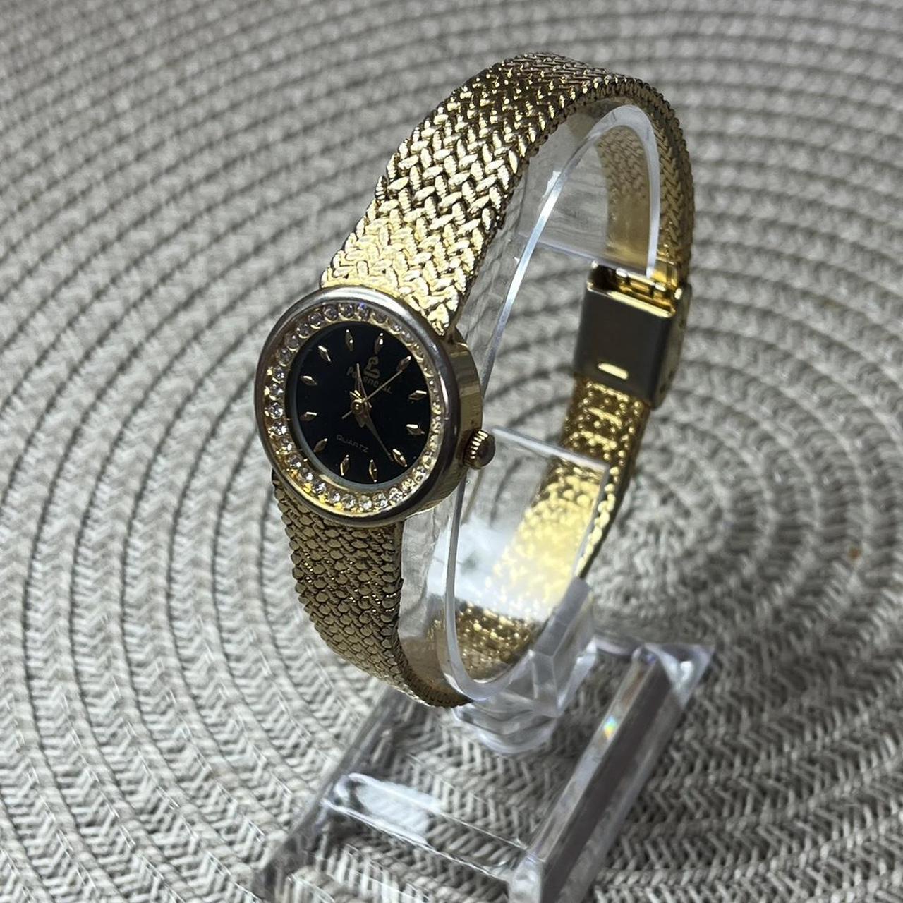 Ladies gold watch with black face best sale