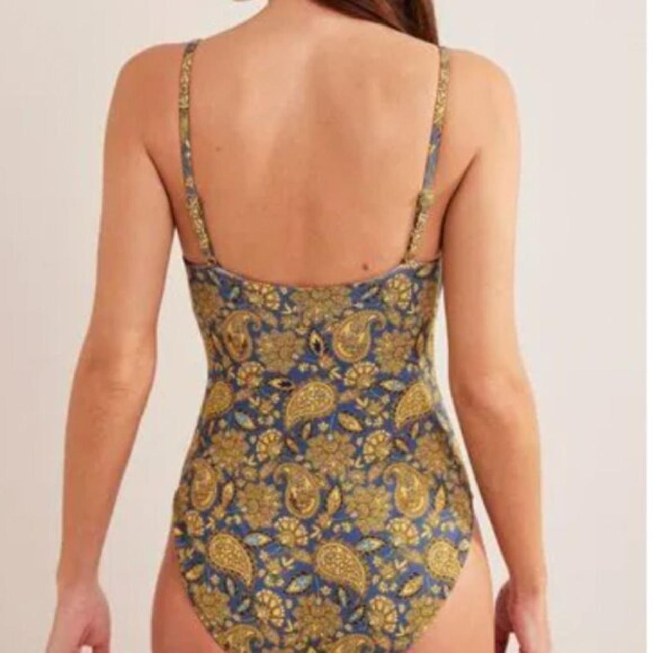 This shape-enhancing twist-front swimsuit