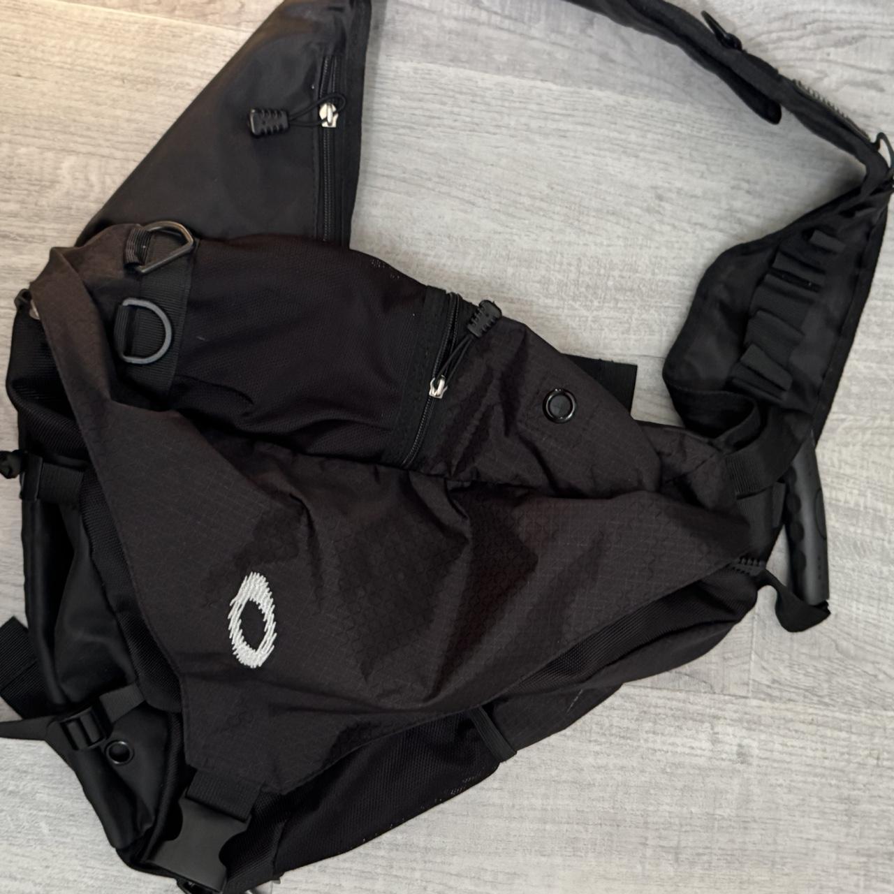 Oakley black sling bag with white logo