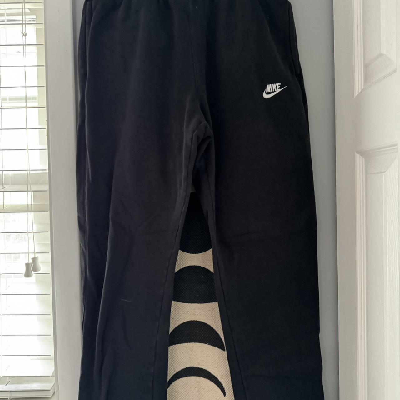 Large black nike sweatpants hole in back pocket. Depop