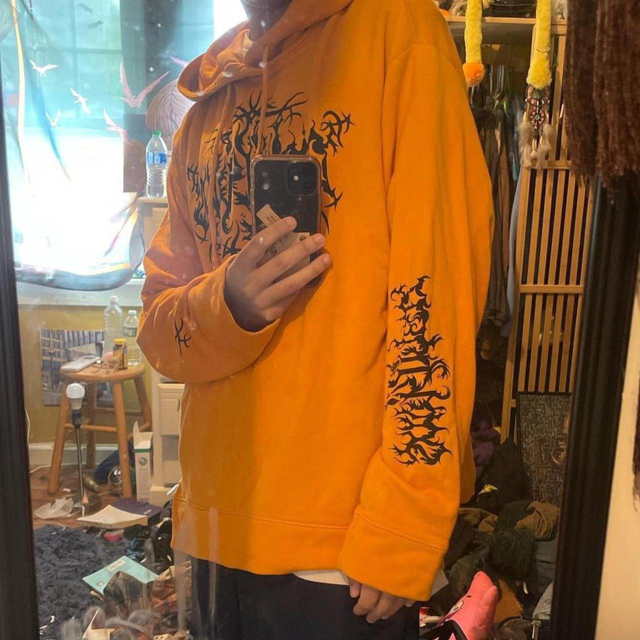 Orange sweatshirt with black writing online