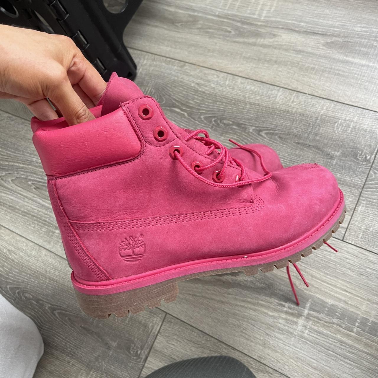 Hot Pink Timberland boots with a small scuff on the