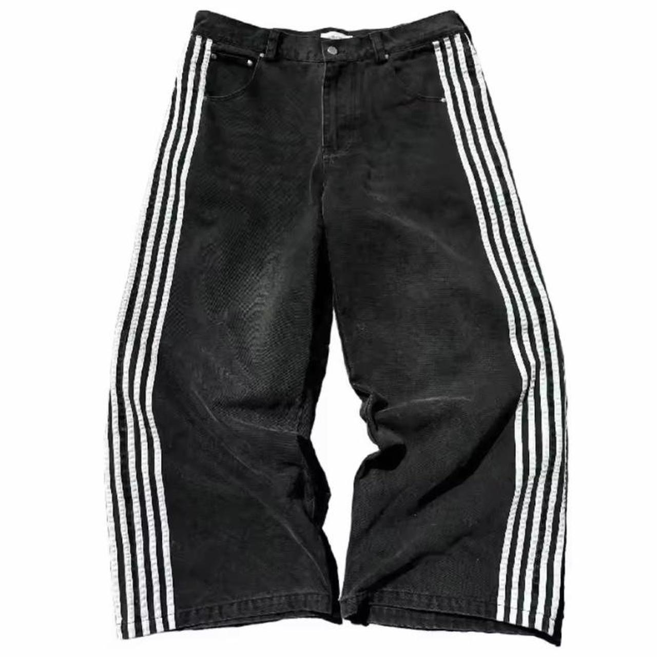 Black denim baggy pants with white stripes on the... Depop
