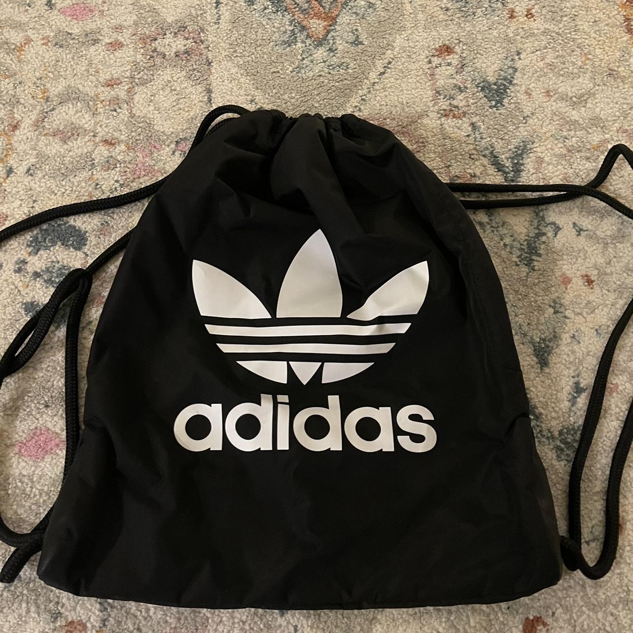 Adidas black and white drawstring bag with zipper