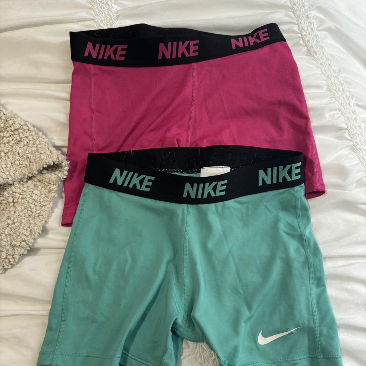 teal and pink nike shorts
