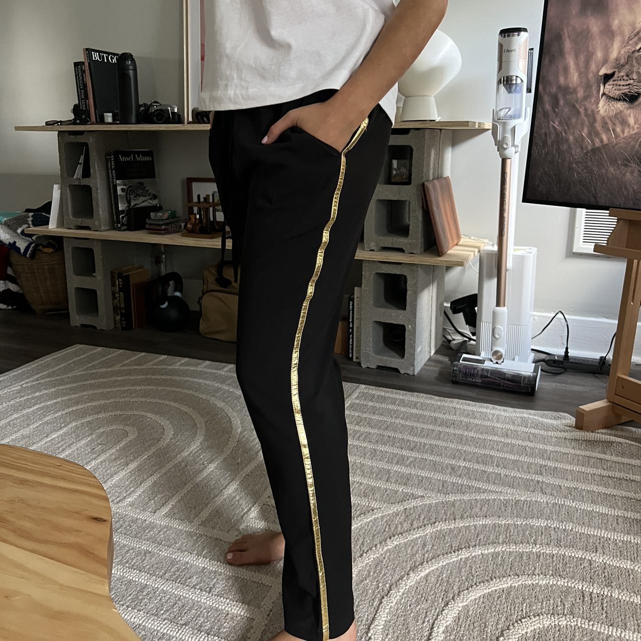 Black and gold striped trousers with elastic waist. Depop