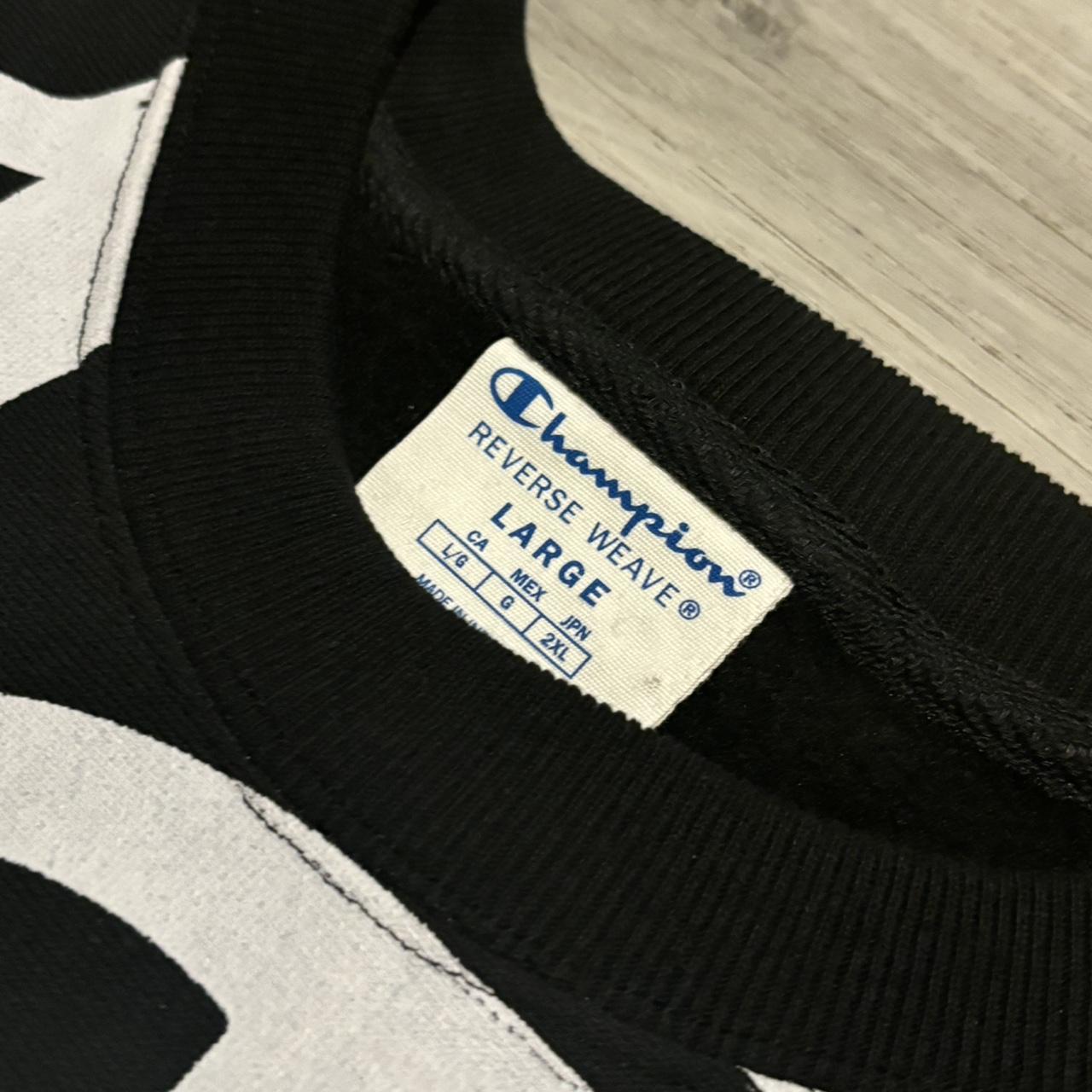 sick black and white champion sweater has that Depop