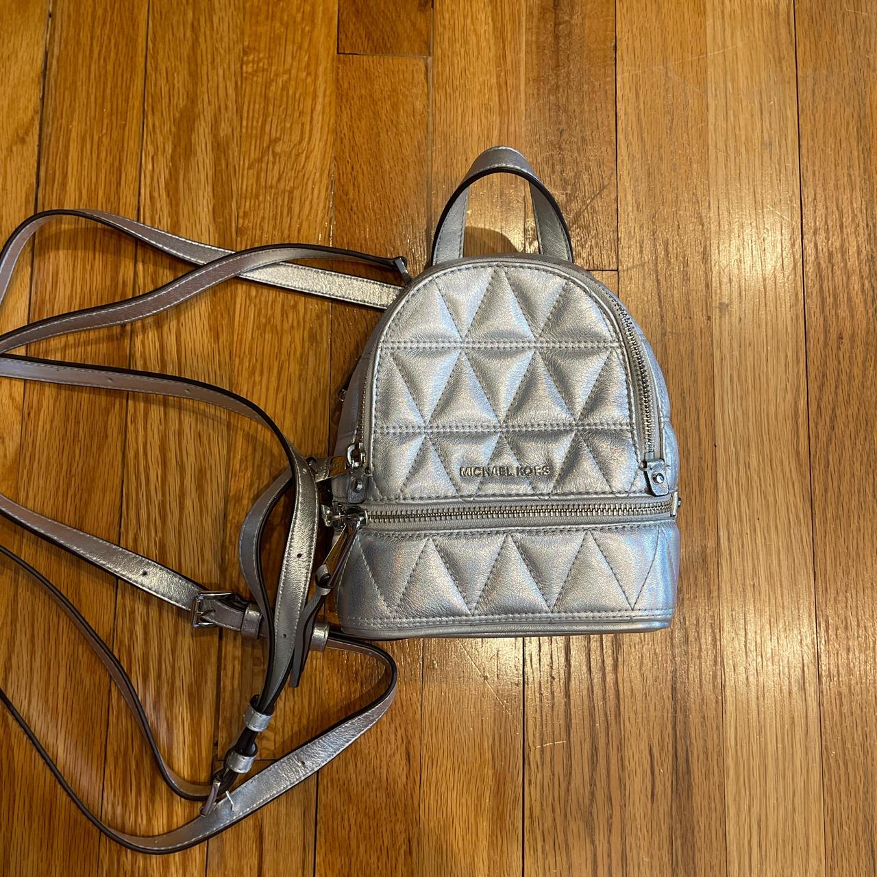 Michael kors silver backpack hotsell