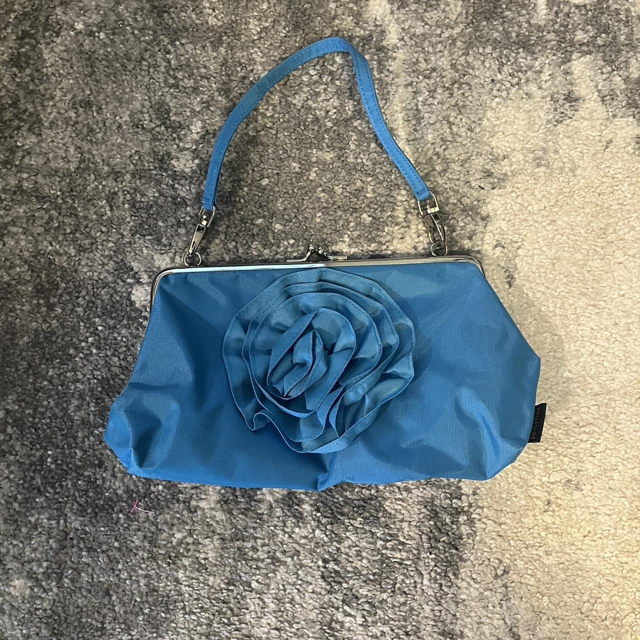 Blue purse with a big flower detail on the front and. Depop