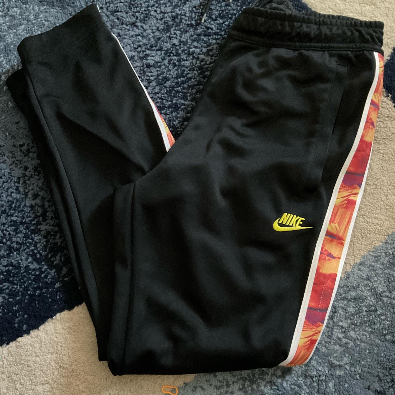 orange and black nike joggers
