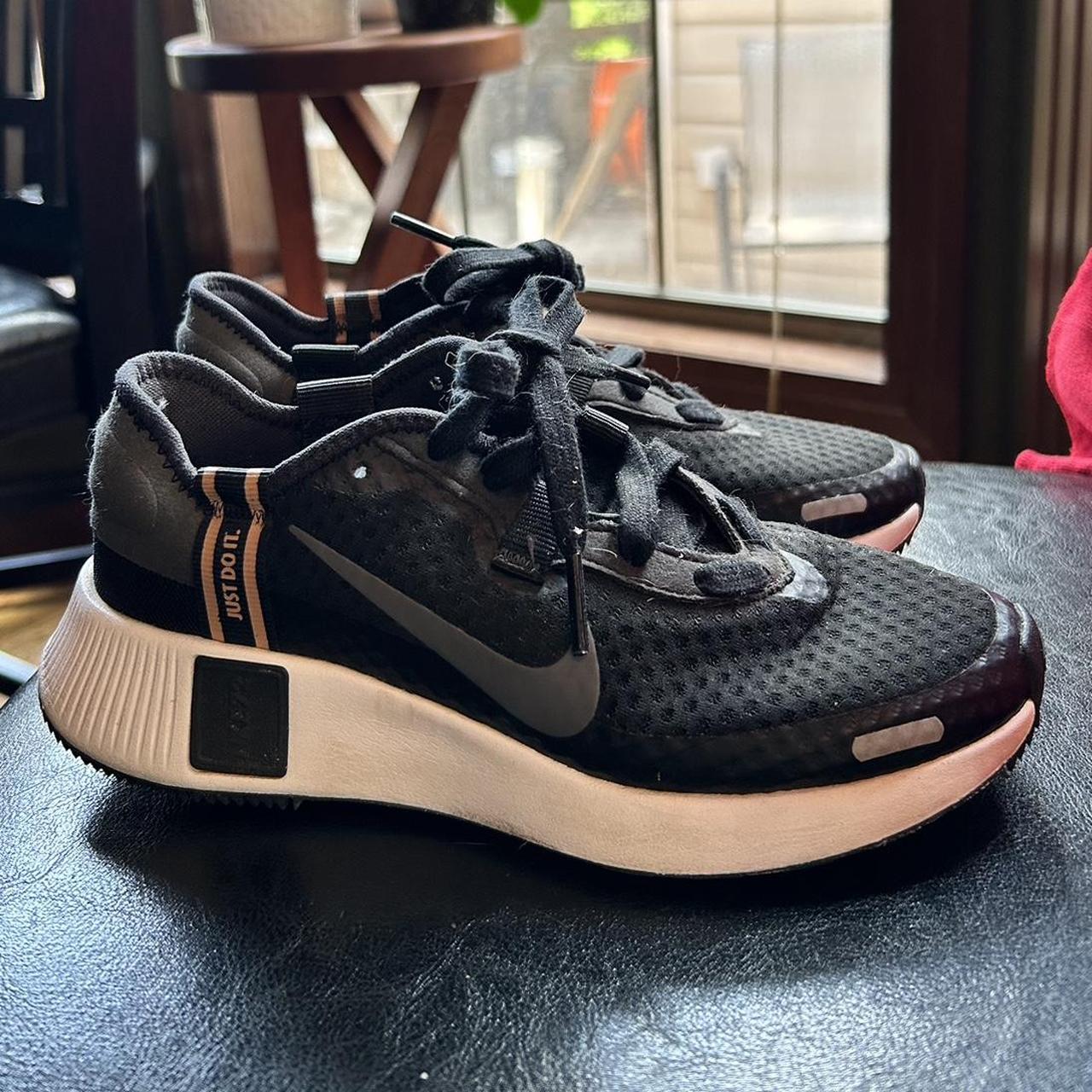 nike reposto black and gold