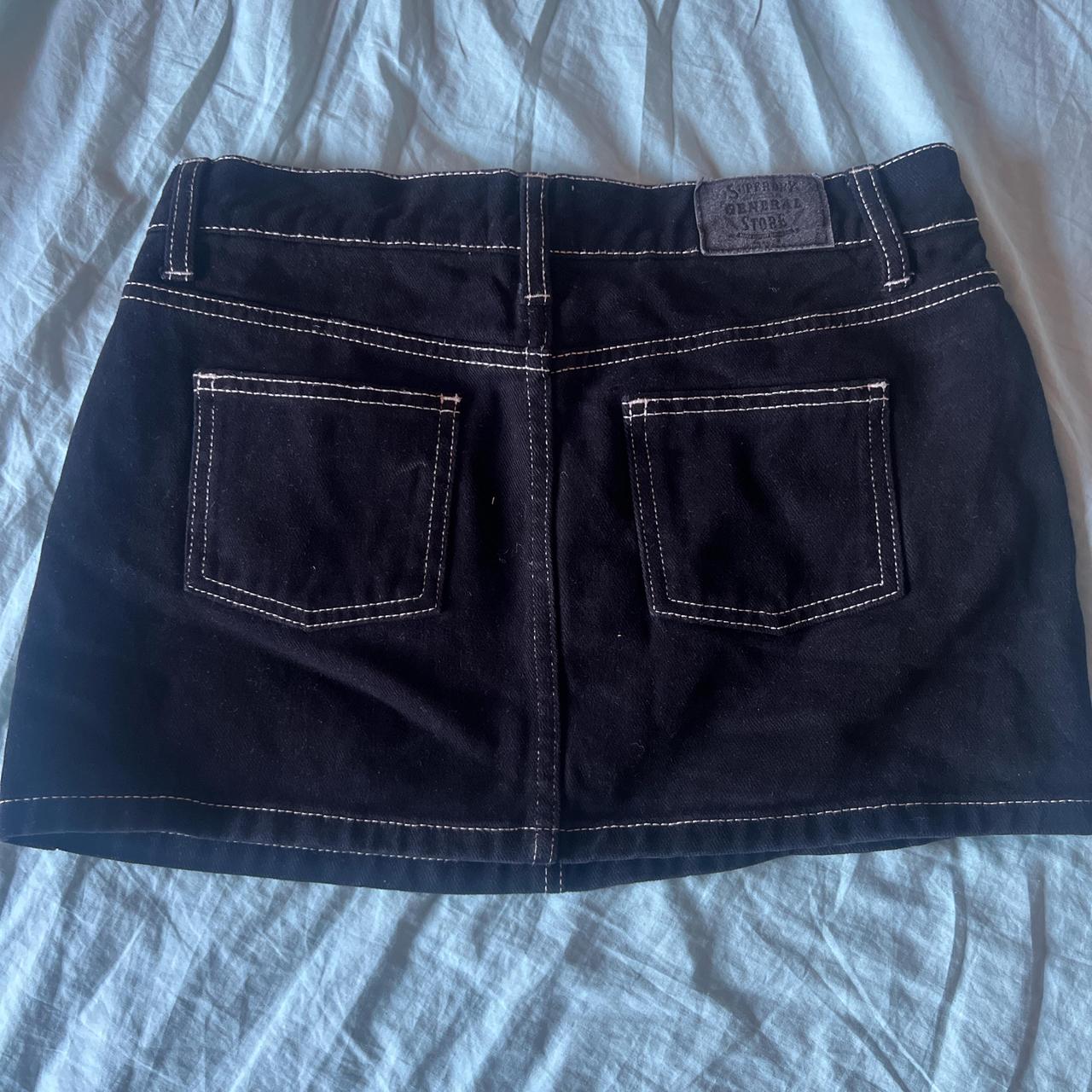 Superdry's black denim mini skirt with white... Depop