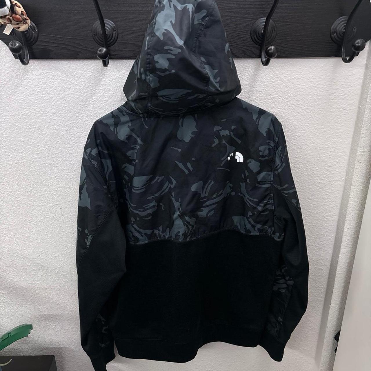 The North Face black and grey camo rain jacket. Depop