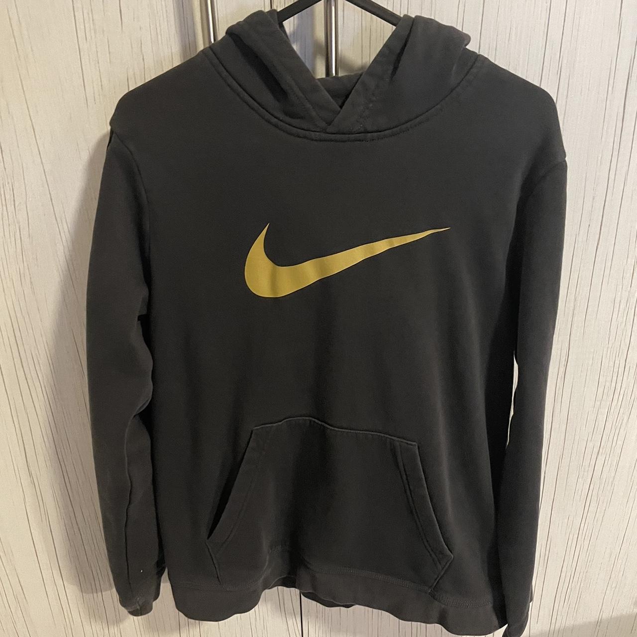 Teens Nike charcoal and gold coloured hoodie size. Depop