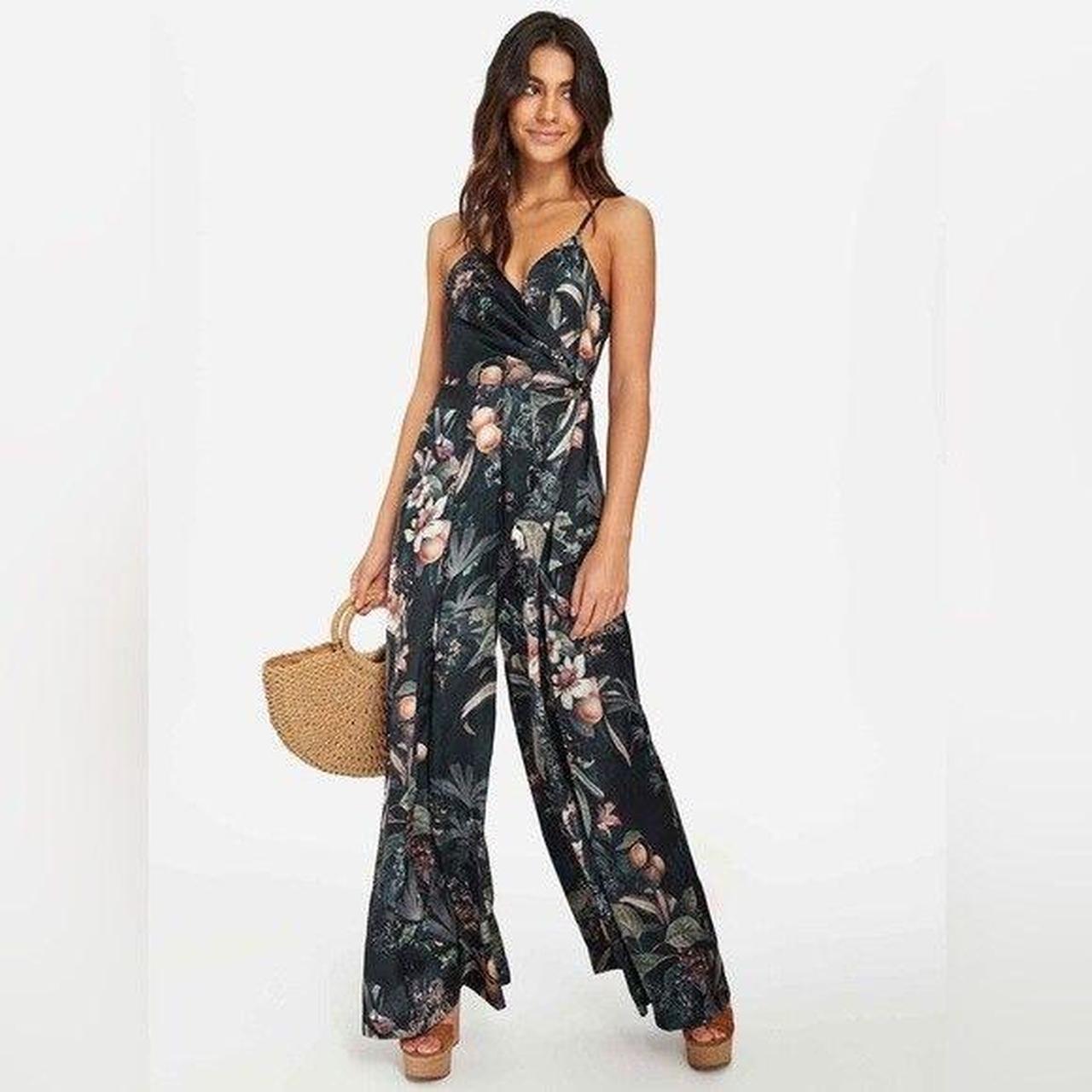 Sheike palazzo jumpsuit in a floral tropical print. Depop