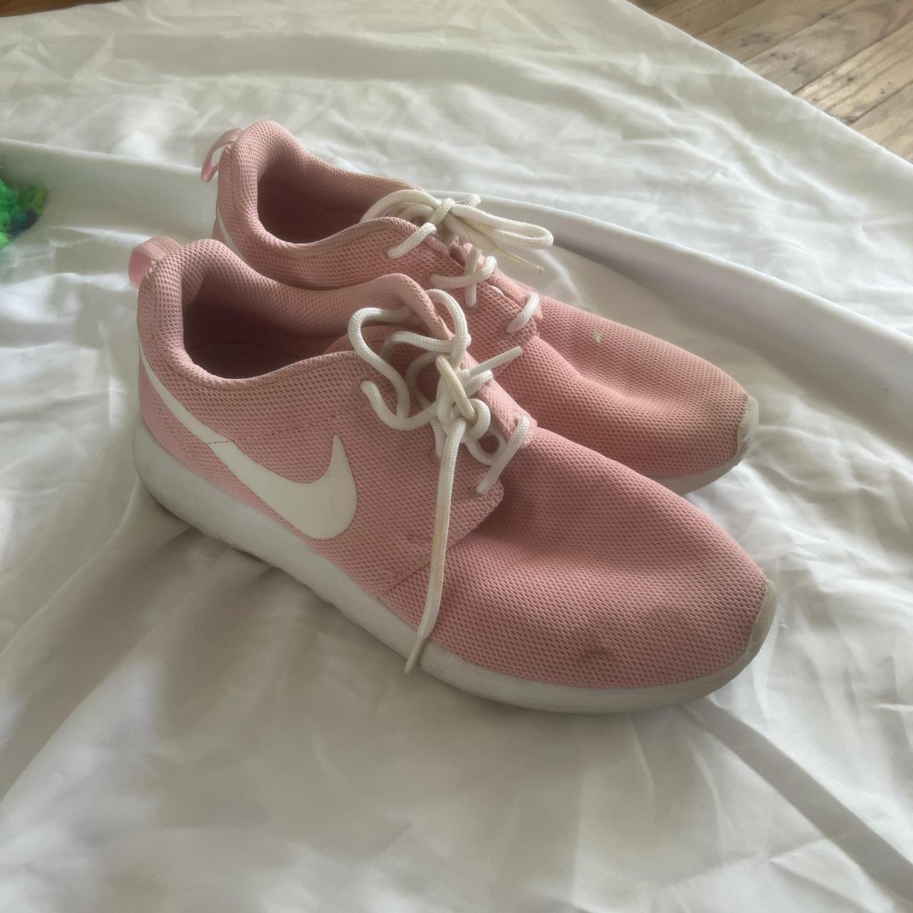 Pink and white Nike Roshe Runs trainers