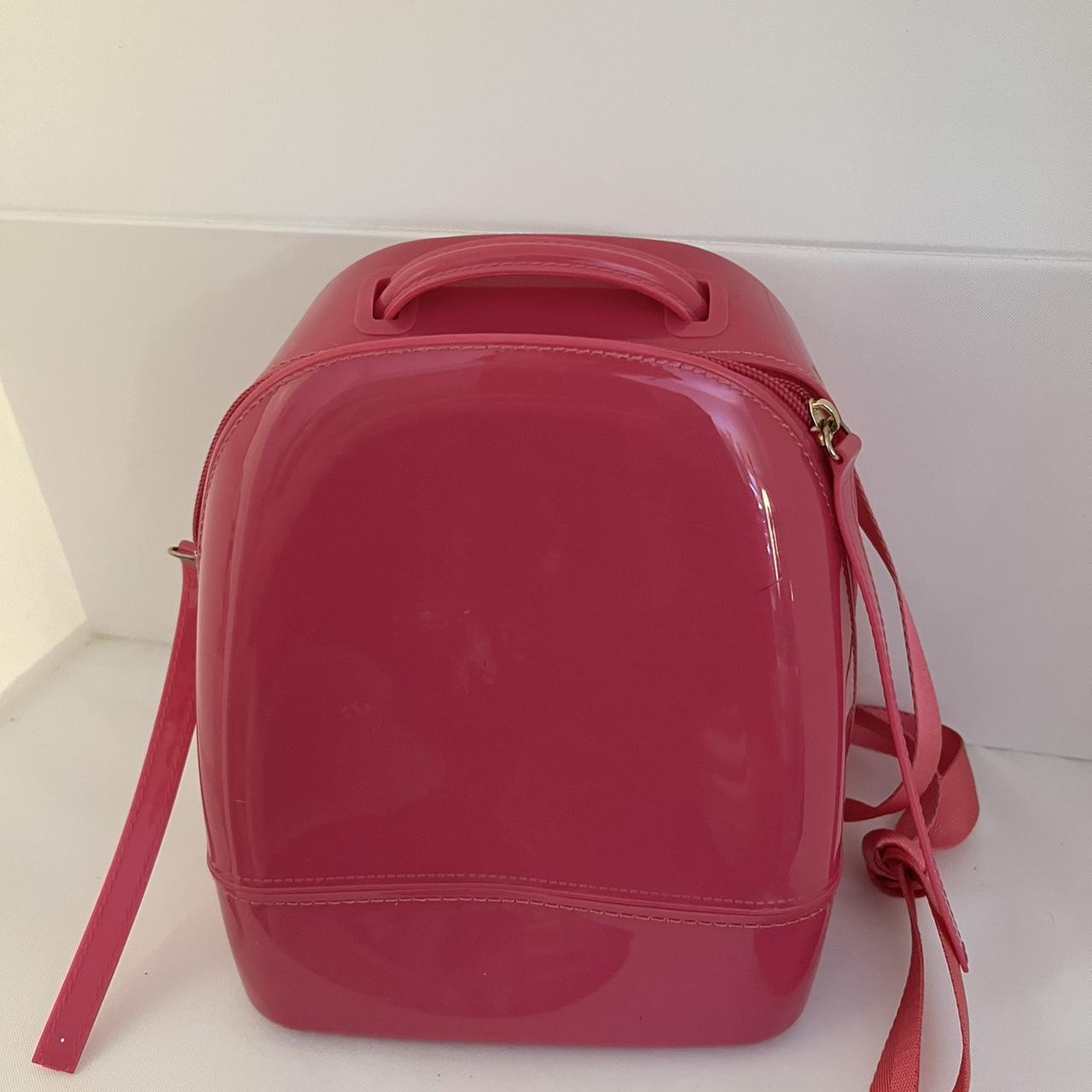 Hot pink mini backpack with a zipper closure and a. Depop