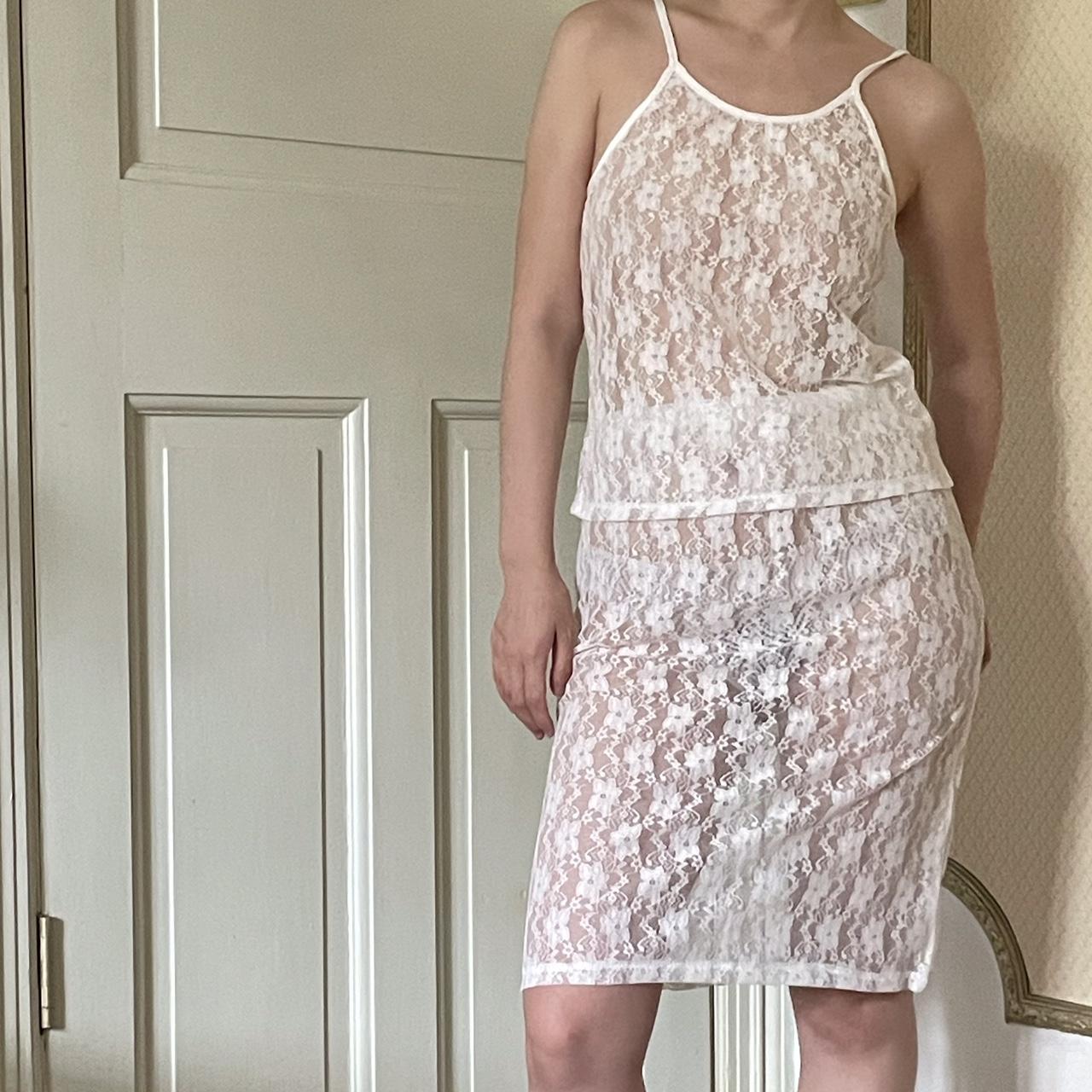 White lace slip dress with adjustable straps and a... - Depop