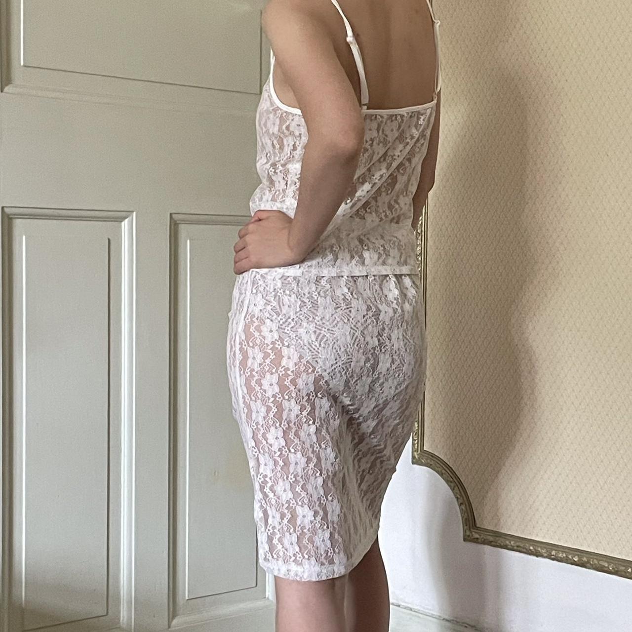 White lace slip dress with adjustable straps and a... - Depop