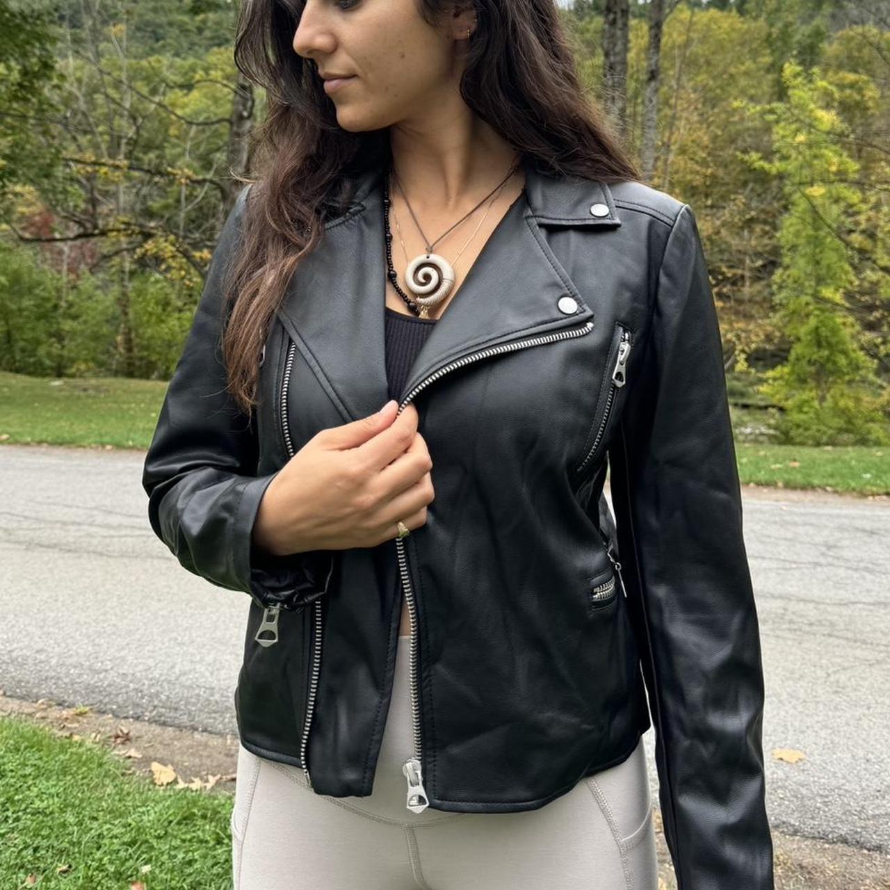 Black leather biker jacket with a silver zipper. Depop