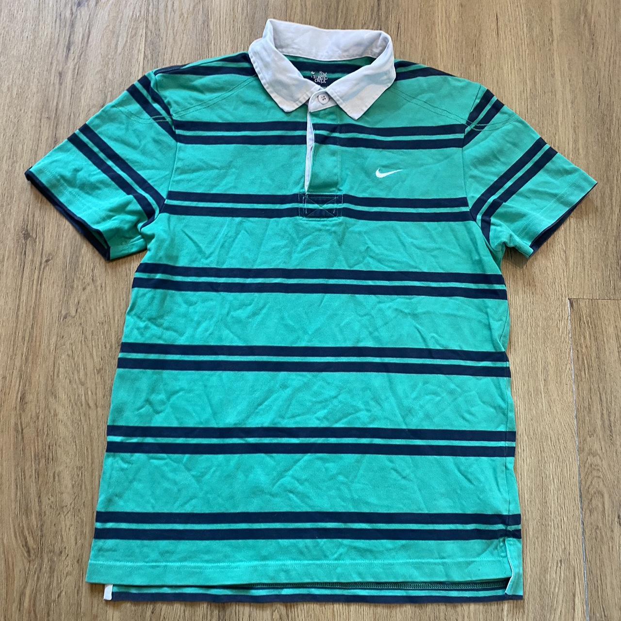 turquoise and black nike shirt