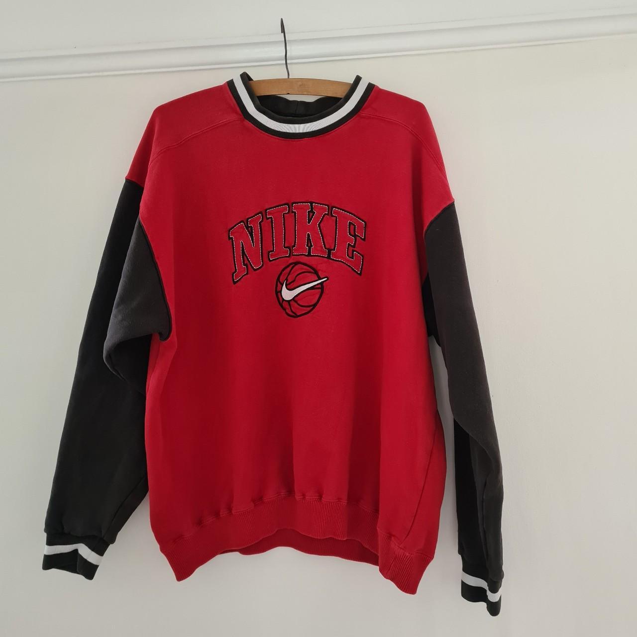 black nike sweatshirt with red tick