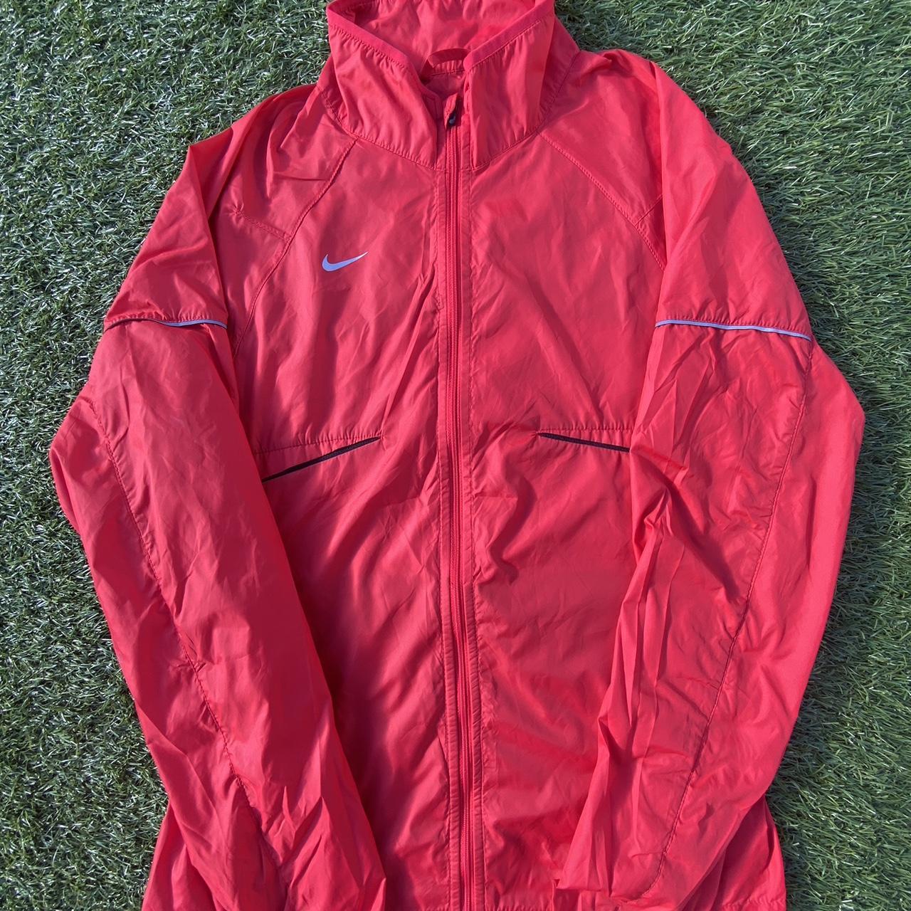 Nike red windbreaker jacket Very good condition no. Depop