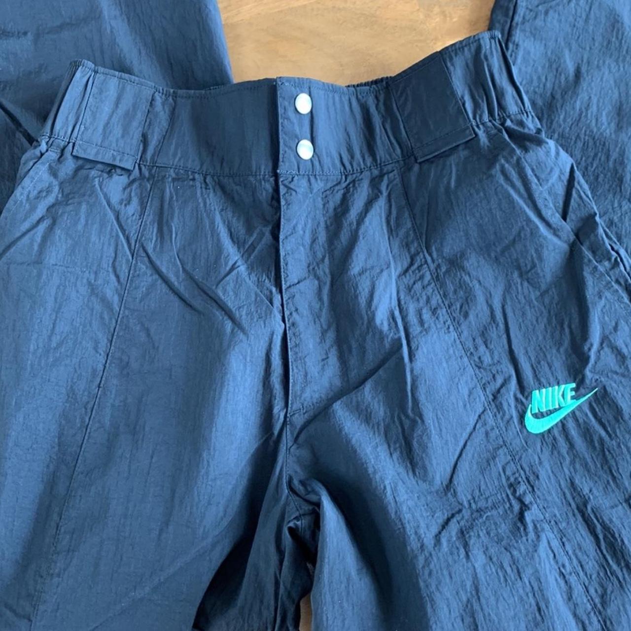 Nike black cargo pants with green embroidery on