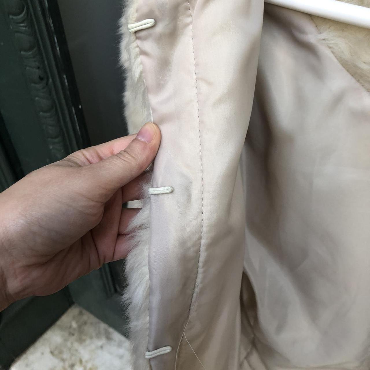 Cream faux fur jacket with warm undertones. It has a... - Depop