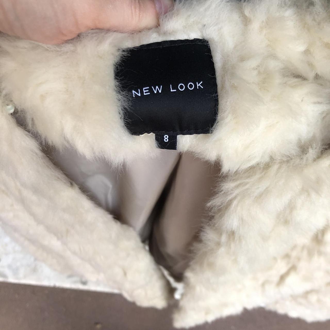 Cream faux fur jacket with warm undertones. It has a... - Depop