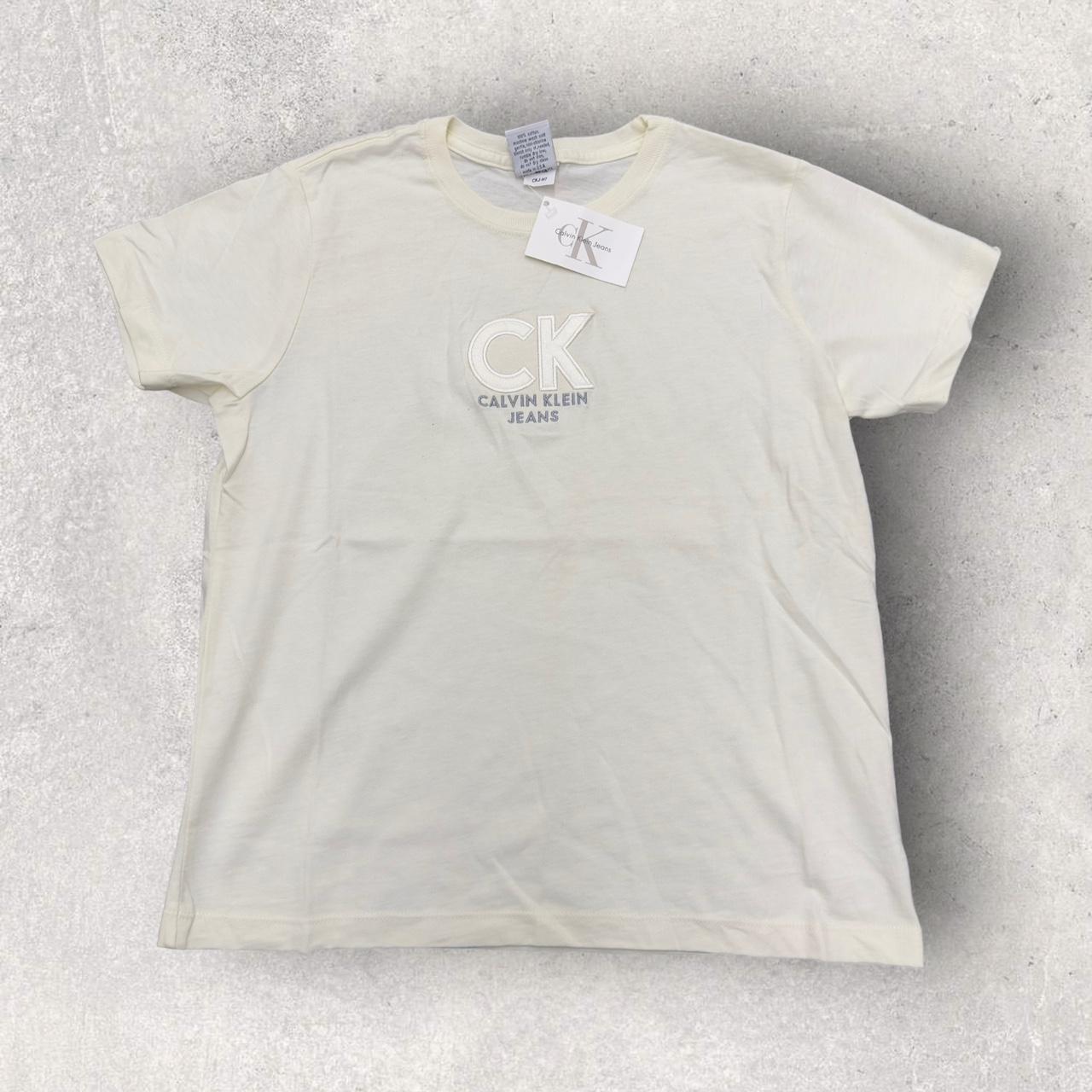 Vintage Calvin Klein Jeans tee in cream. From the...
