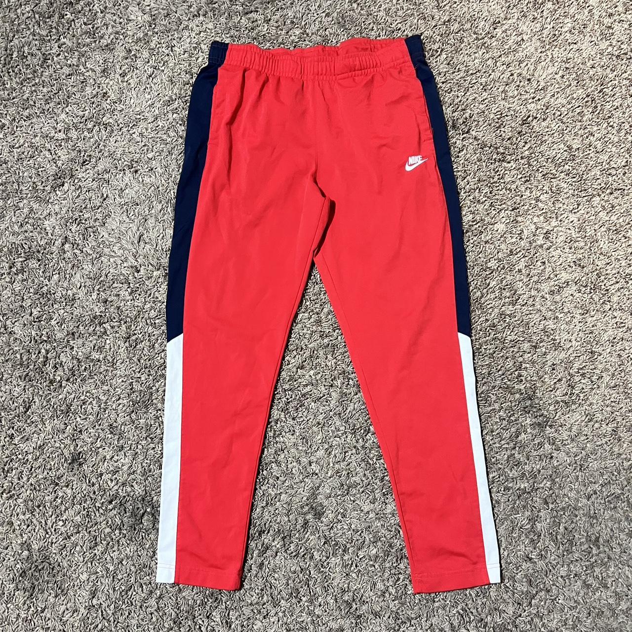 red and blue nike joggers