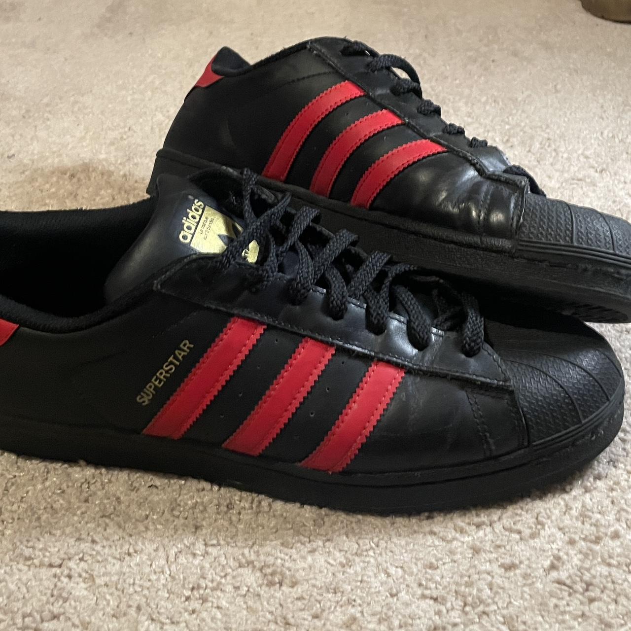 Core black vivid red adidas superstars Used Good. Depop