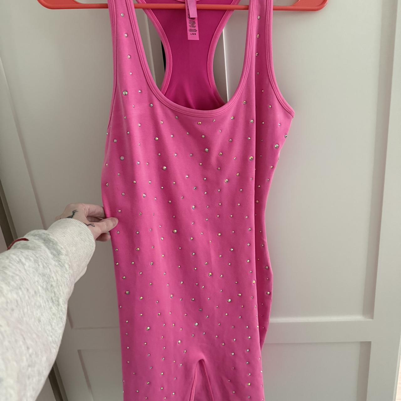 Skims pink rhinestone onesie. Size large. Never worn