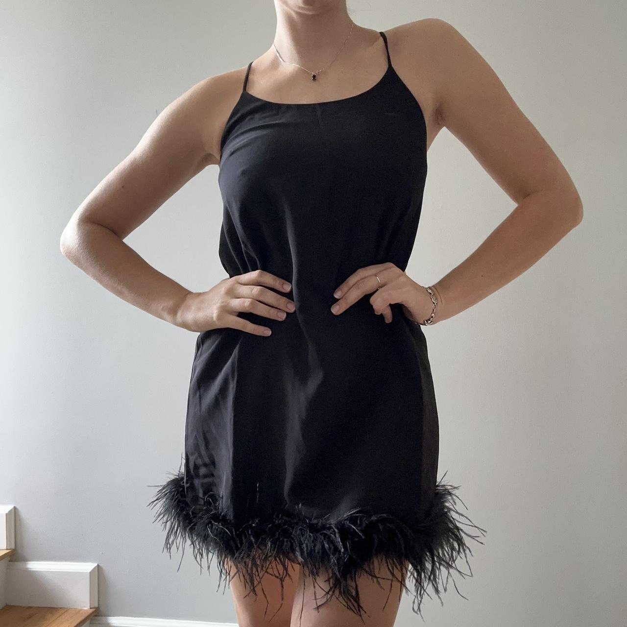 Black high neck dress with feather boa lined bottom... Depop