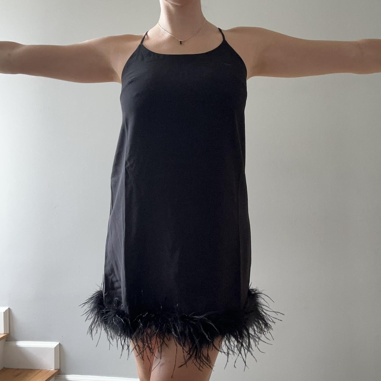 Black high neck dress with feather boa lined bottom... Depop