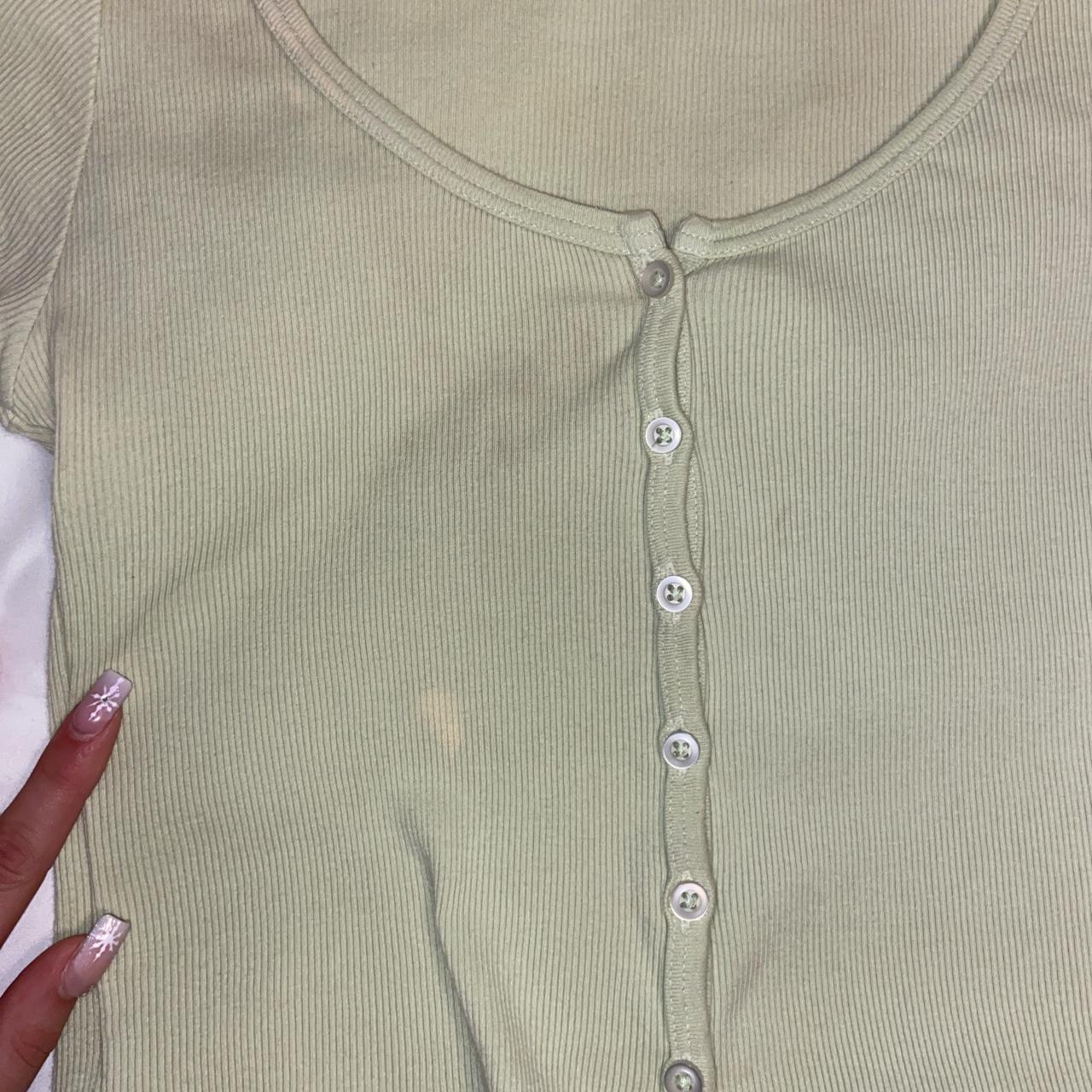 brandy melville green zelly top flaws in photo... Depop