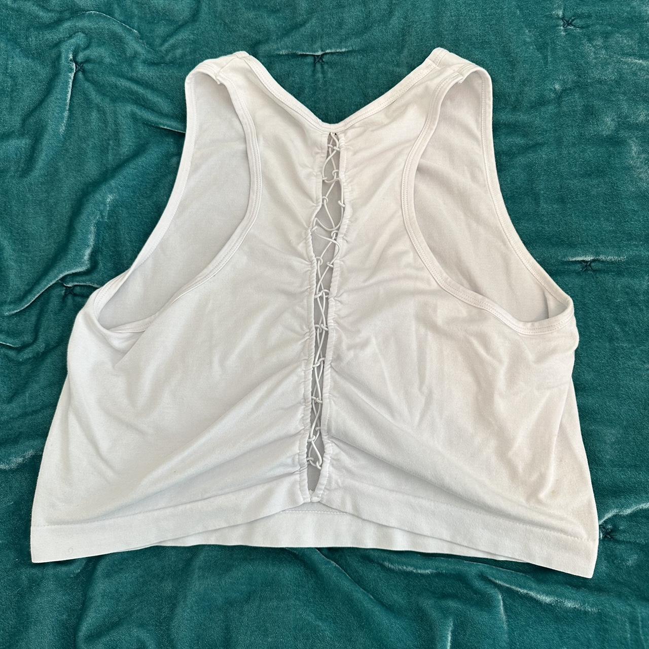 Cute tank top from Fabletics. This has a higher neck - Depop