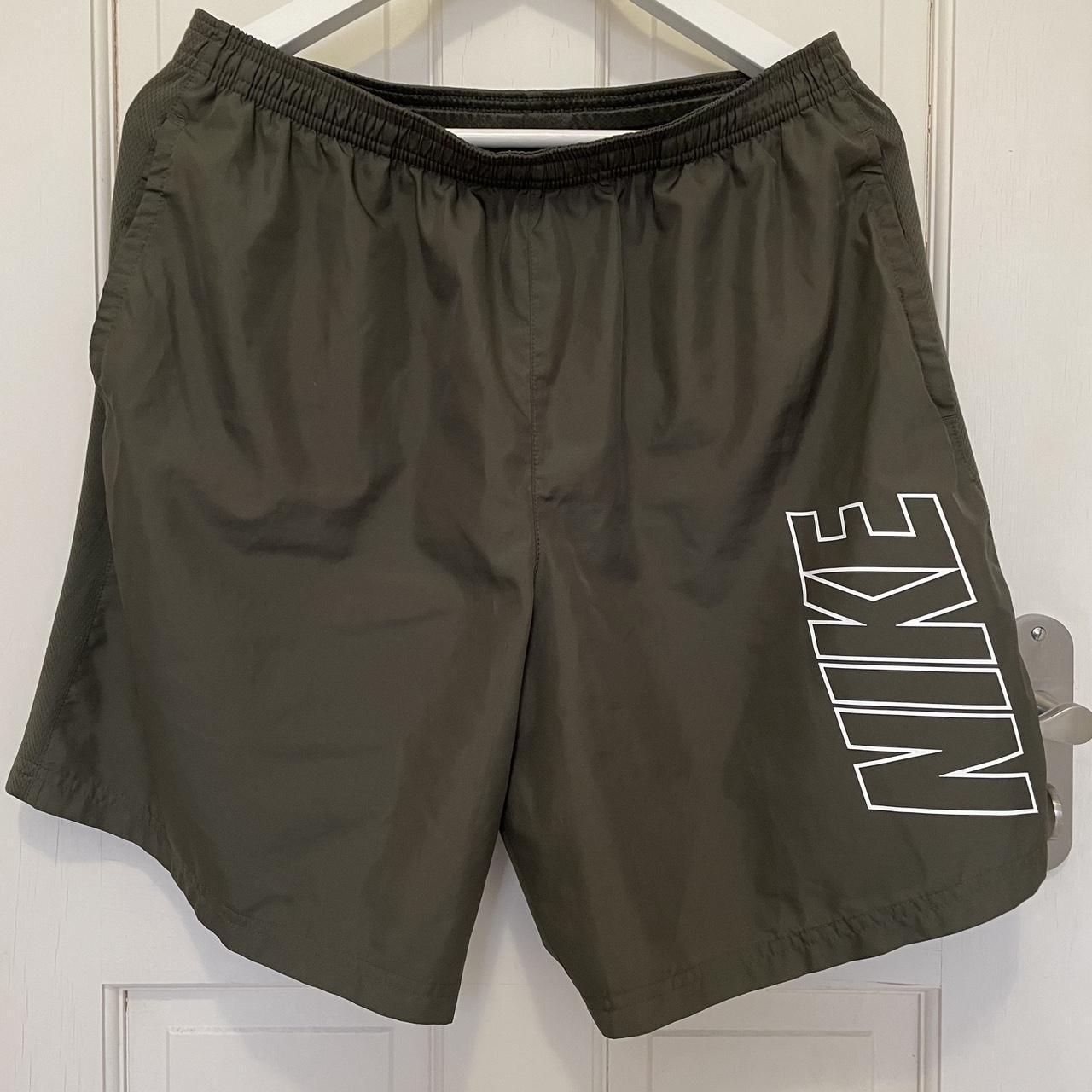 Forest green Nike sports shorts with pockets. Thin... Depop