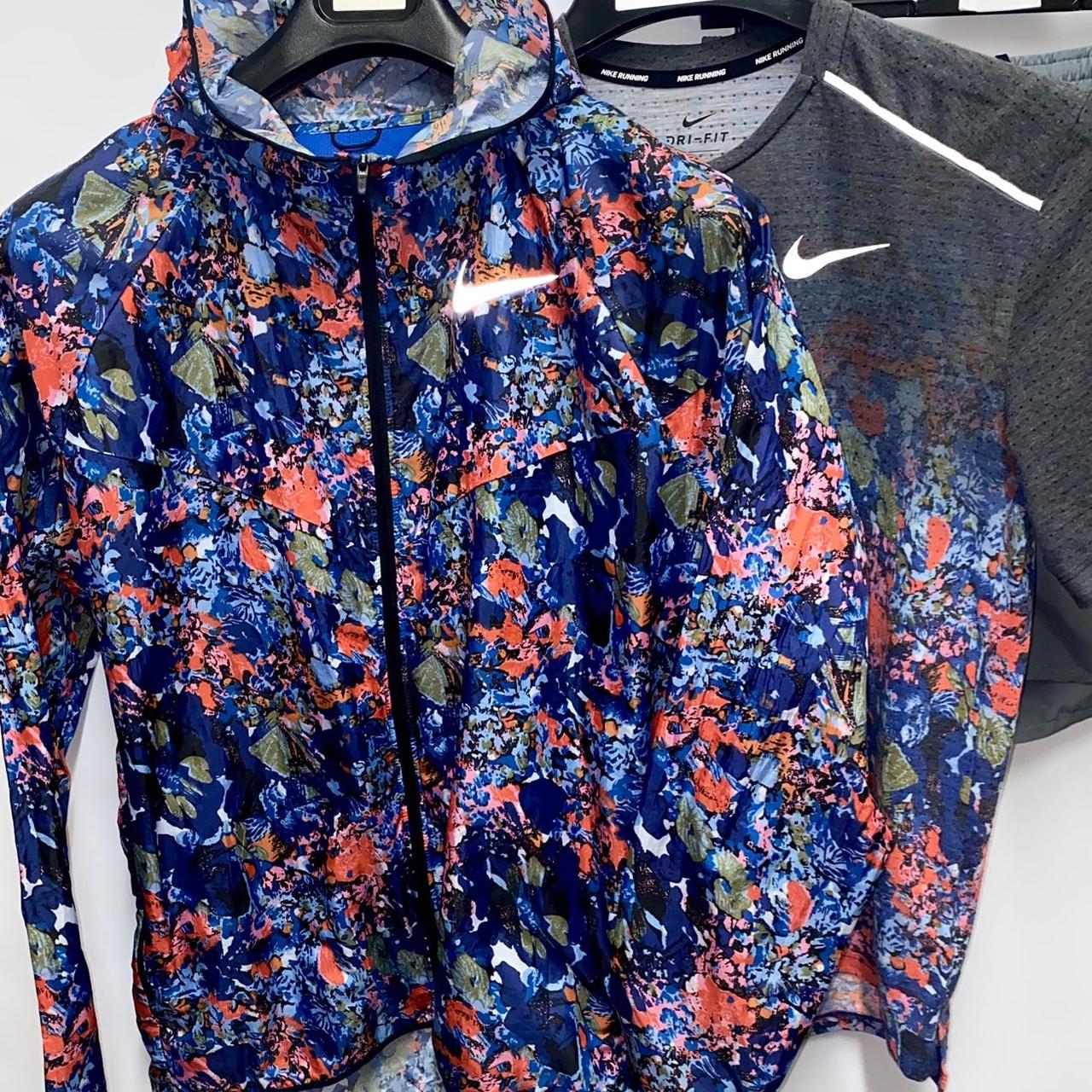 Nike floral running jacket sale