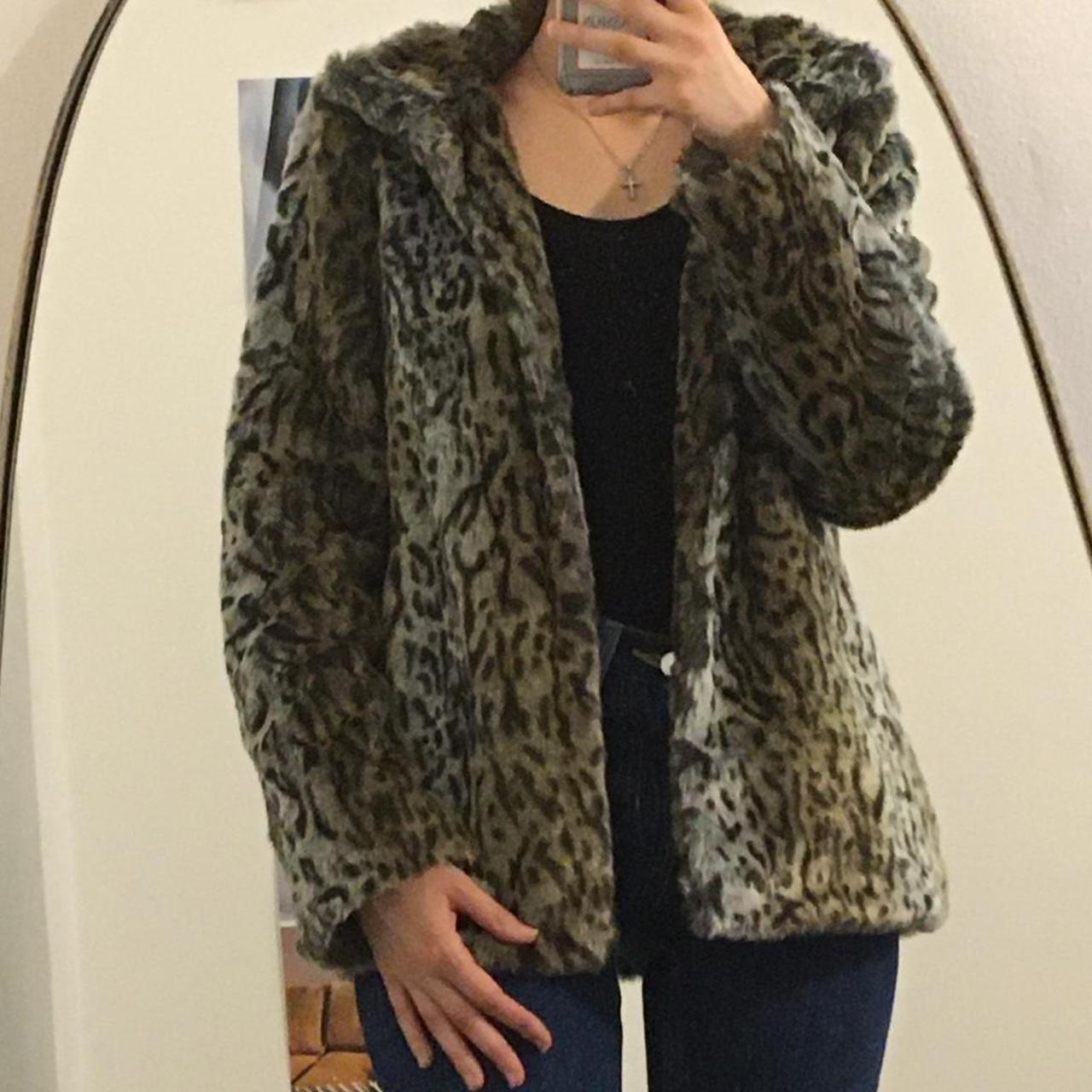 Faux fur animal/leopard print coat. Is a size 12 but... - Depop