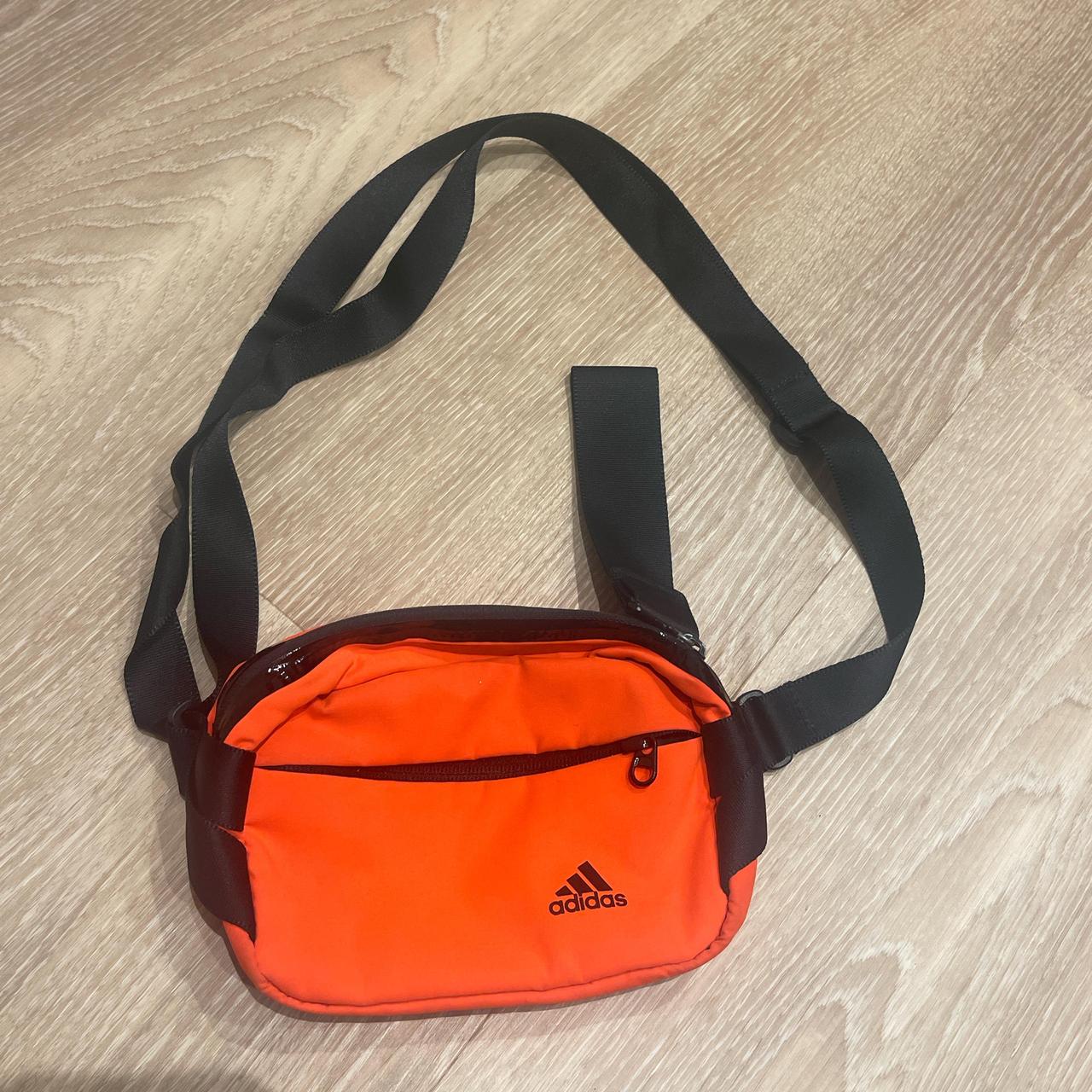 Adidas orange and black waist bag with adjustable. Depop